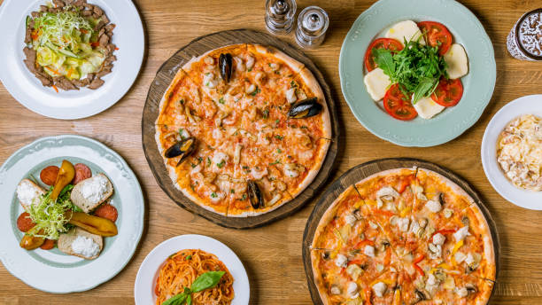 istock Italian pizzas and salads top view 1150382279