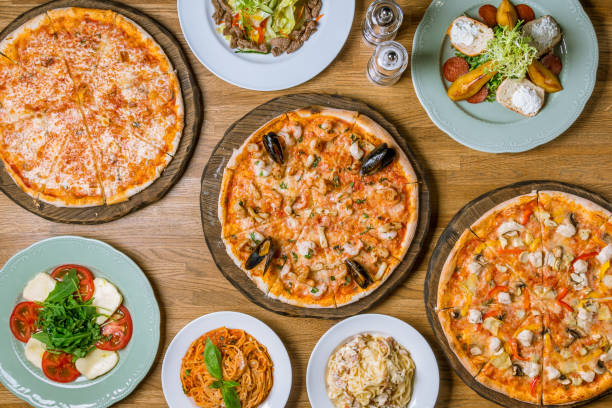 istock Italian pizzas and salads top view 1150382290