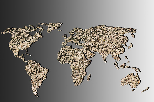 Roughly outlined world map with stone gravel pebble fillings