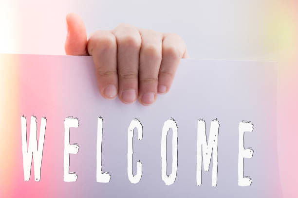 istock Hand holding paper with welcome wording 1150383003