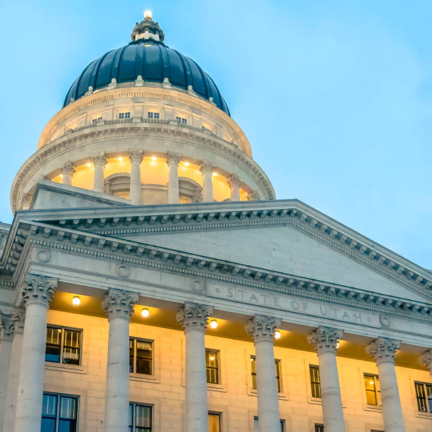 istock Square The magnificent Utah State Capital Building with cloudy blue sky background 1150383548