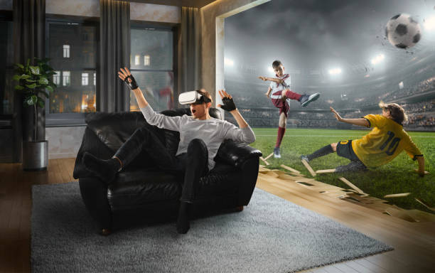 istock Man in VR Glasses. Virtual Reality with children's soccer 1150384162