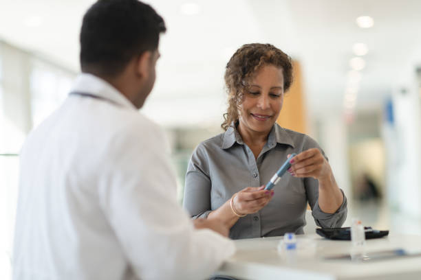 istock Diabetic patient meets with her doctor 1150384304