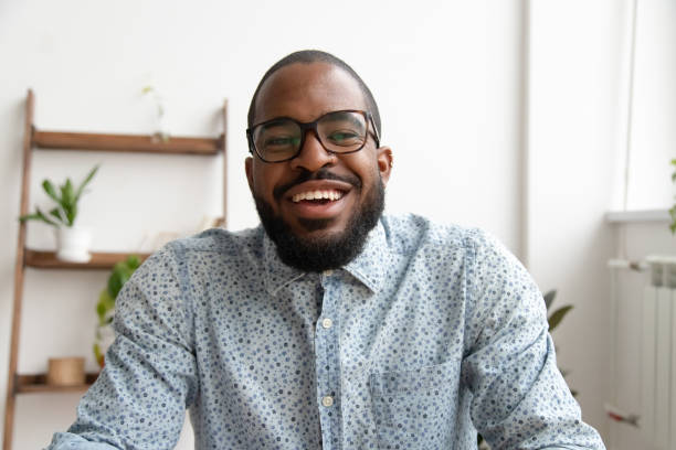 istock Happy african businessman looking at webcam making conference video call 1150384566