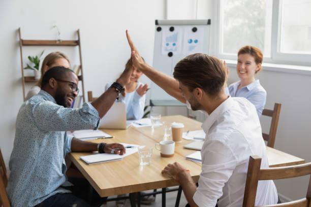 istock Happy diverse male colleagues giving high five celebrating shared win 1150384610