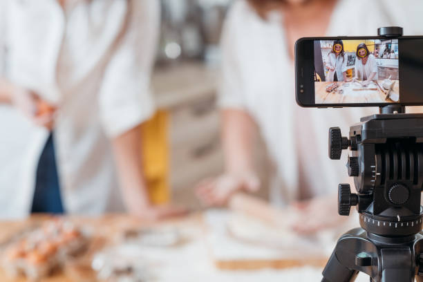 istock culinary vlog women baking smartphone online hobby 1150384874
