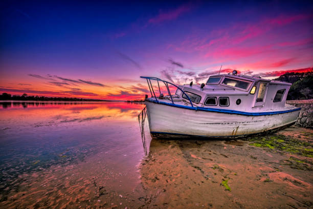 istock Fishing boat at sunset 1150385144