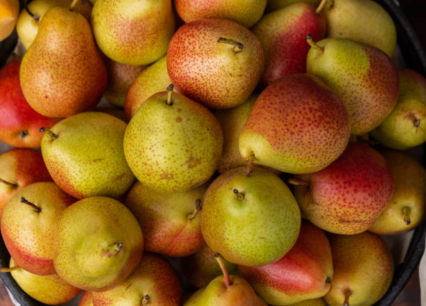 istock Set of appetizing pears in a basket 1150392316
