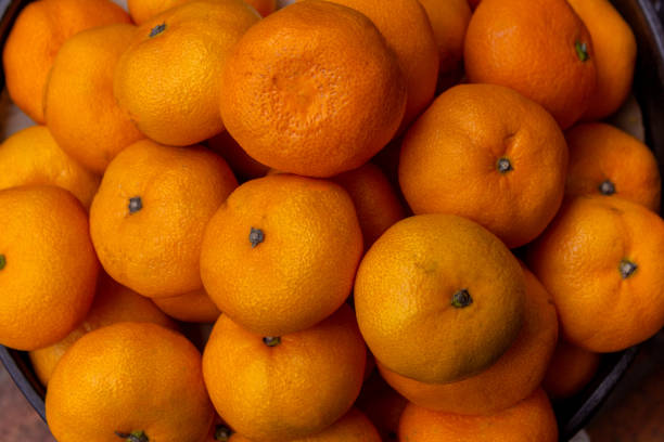 istock Juicy tangerines displayed for sale 1150392353