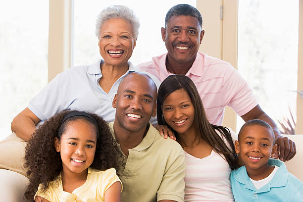 istock Extended family sitting on sofa 115039381