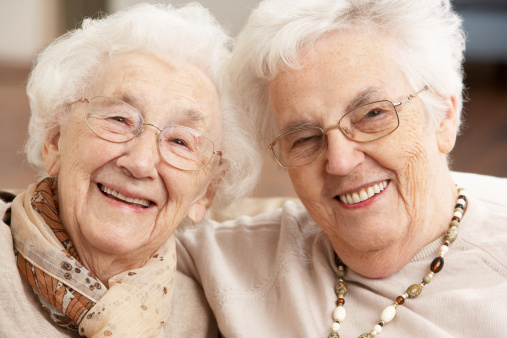 Two Senior Women Friends At Day Care Centre Smiling