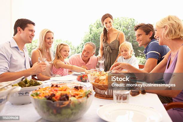 Extended Family Enjoying Picnic Stock Photo - Download Image Now - Family, Lunch, Outdoors