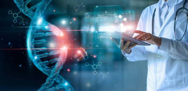 Abstract luminous DNA molecule. Doctor using tablet and check with analysis chromosome DNA genetic of human on virtual interface. Medicine. Medical science and biotechnology. Abstract luminous DNA molecule. Doctor using tablet and check with analysis chromosome DNA genetic of human on virtual interface. Medicine. Medical science and biotechnology. helix photos stock pictures, royalty-free photos & images