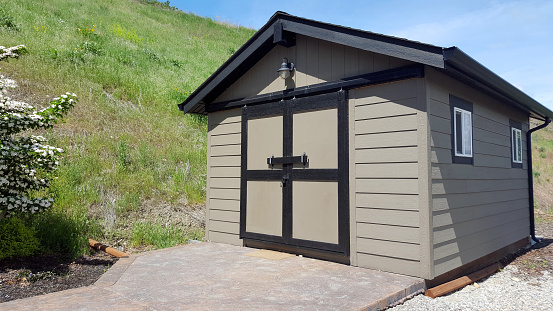 Vernon, British Columbia,Canada- May,19,2019: Stand alone shed complete with door and windows and electricity.  Looks good with siding and roof.