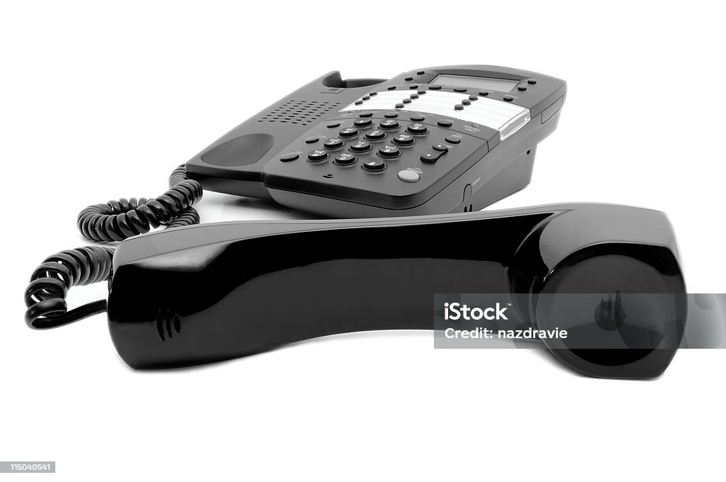 Telefono ufficio nero con Cornetta sganciata isolato su sfondo bianco - Foto stock royalty-free di Affari