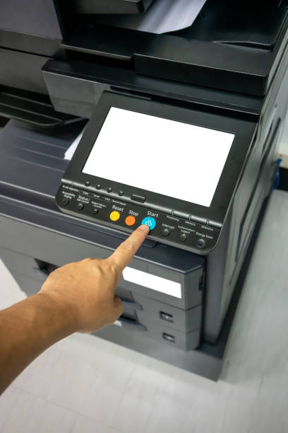 istock Close-up man Hand press button on panel of printer, printer scanner laser office copy machine supplies start concept. 1150406020