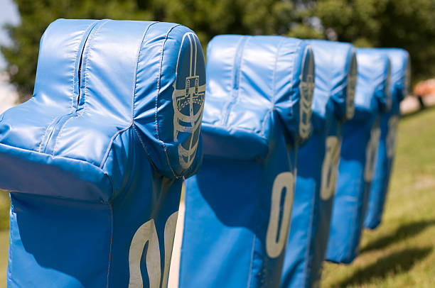 Football Practice Blocking Sled Training Dummies in a Row stock photo