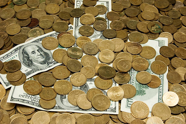 istock Dollars and Macedonian Denars on the coins background 115040770