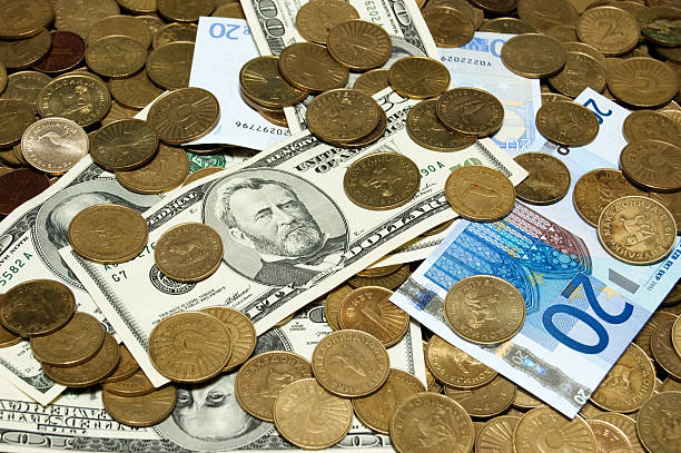 istock Dollars, Denars and Euros on the coins background 115040771