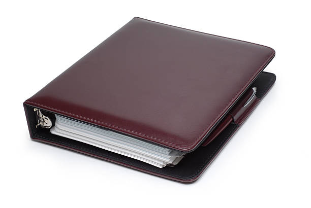 手帳日プランナーの白い背景に - leather folder ストックフォトと画像