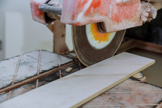 istock Circular saw cutting ceramic tile electro saw on the construction 1150408593