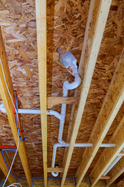 istock White PVS pipeline under white ceiling in the new building. construction industry pipeline for drainage system 1150408612