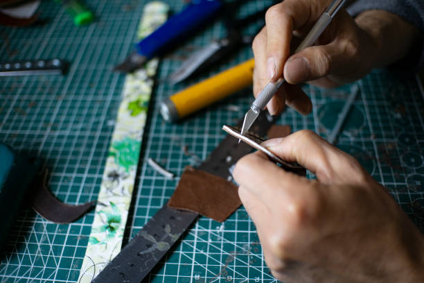 istock craftsman working on handmade leather bag 1150408635