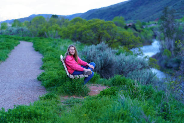 Girl Sitting on Park Bench
