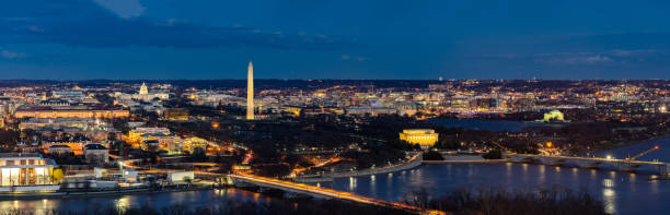 Washington DC Aerial panorama Panorama Aerial view of Washington DC cityscape from Arlington Virginia USA. washington monument washington dc stock pictures, royalty-free photos & images