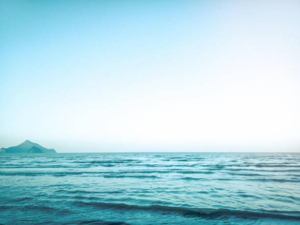 istock Tropical sea and blue sky island mountain 1150414211