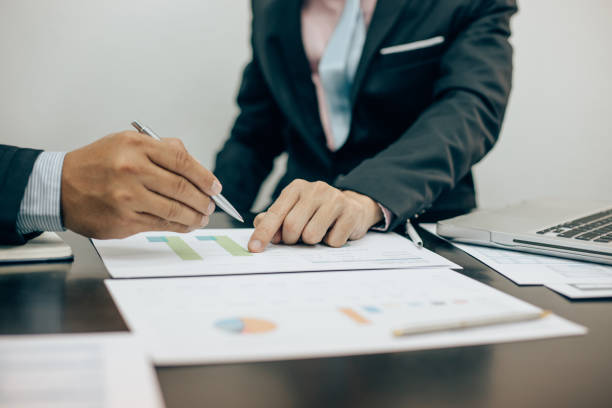 istock Teamwork process, business people working in the office discussing documents and ideas at meeting 1150416905
