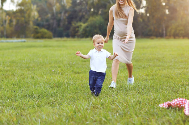 istock Mother with a child plays in the park. 1150418170