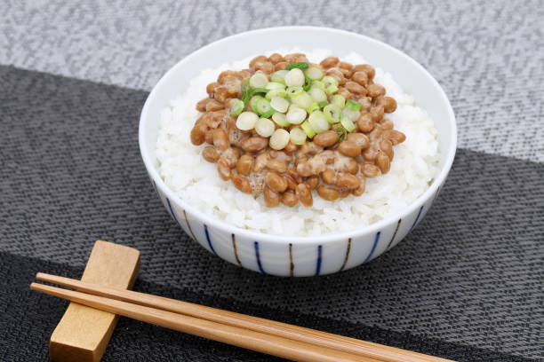 Japanese cooked rice with natto Japanese cooked white rice with Natto on table natto stock pictures, royalty-free photos & images