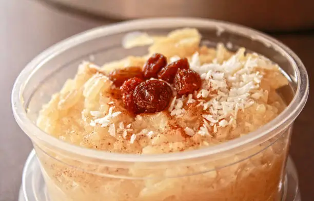 Peruvian rice pudding (Arroz con leche) with raisins and coconut sold at the streets of Lima