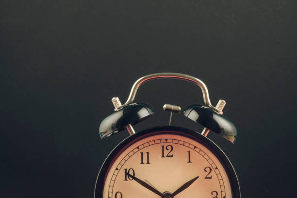 istock Time management concept, alarm clock on dark background. copy space for text 1150424071