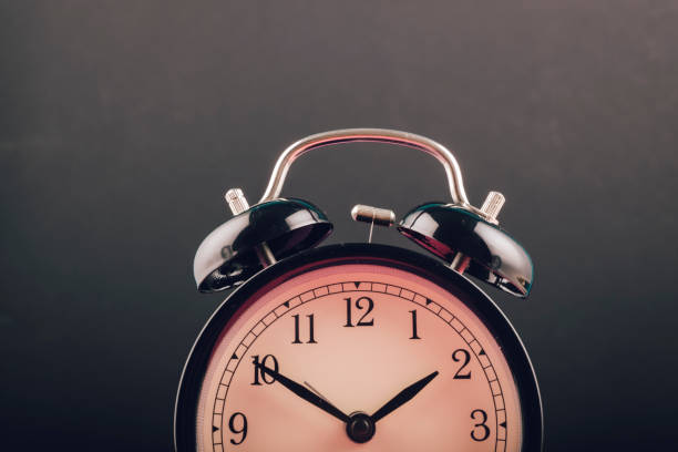istock Time management concept, alarm clock on dark background. copy space for text 1150424077