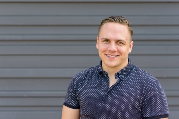 istock Handsome young man with a warm friendly smile 1150424130