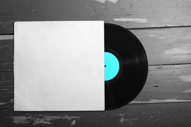 istock Old vinyl record on old  wooden background. 1150425205