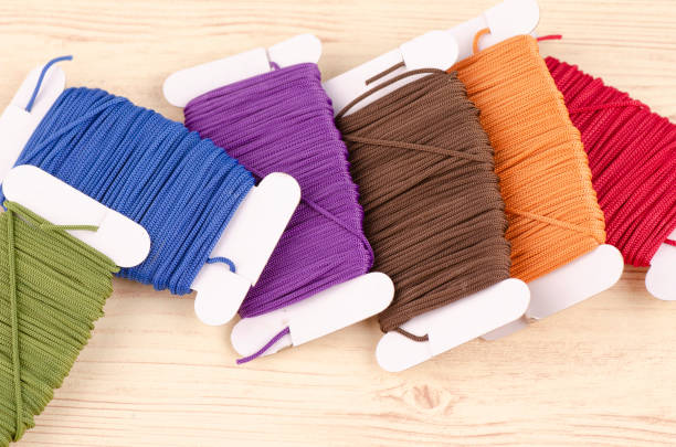 istock colorful stacking cotton yarn wool on wooden background. copy space for text 1150426956