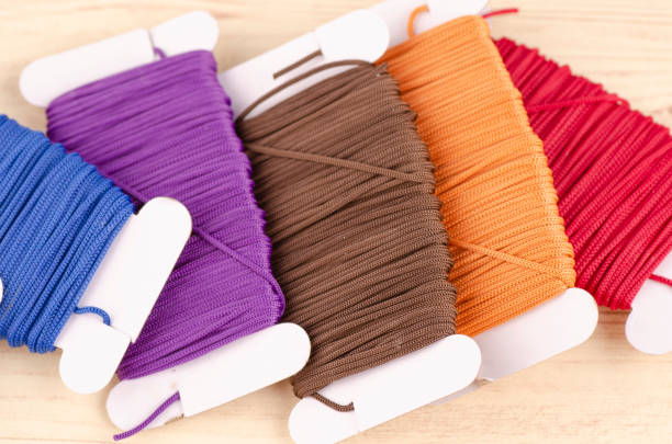 istock colorful stacking cotton yarn wool on wooden background. copy space for text 1150426966