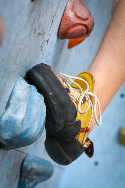 istock Teenage Boy Training Climbing On Indoor Climbing Wall 1150427499