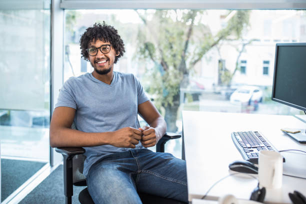 istock Happy African American programmer working in the office. 1150427561
