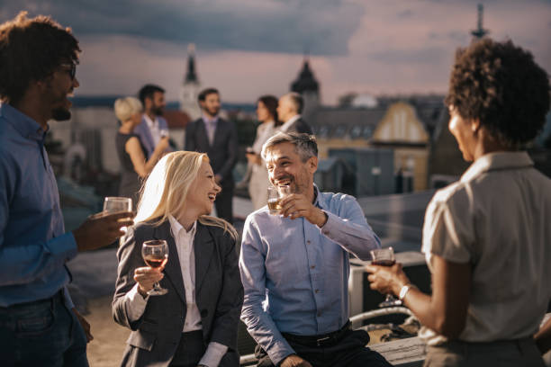 istock Cheerful managers having fun while talking at the outdoor party. 1150428477