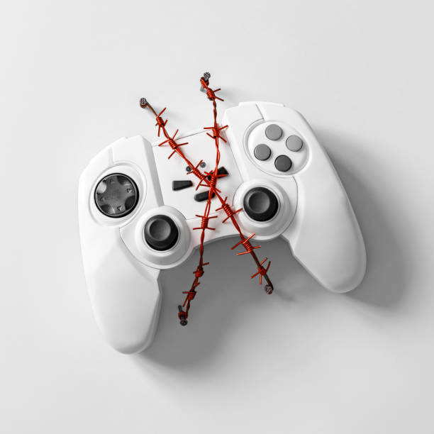 gamepad com arame farpado vermelho. - compulsive gambling - fotografias e filmes do acervo