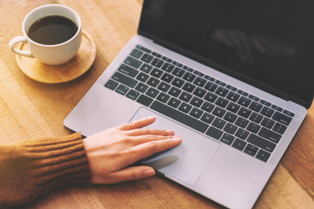 istock a woman's hand using and touching on laptop touchpad 1150430791