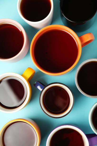 istock Black tea (coffee) in bright cups, office break, team building 1150433461