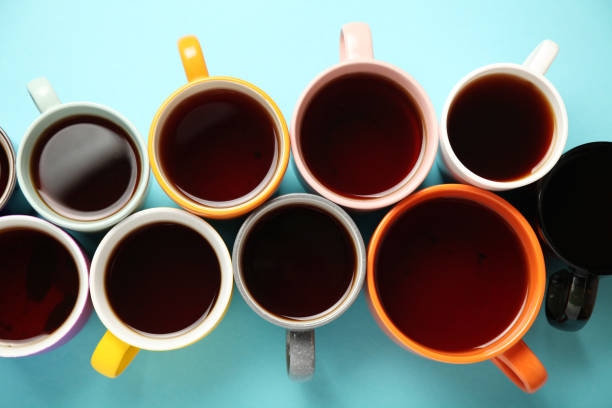 istock Black tea (coffee) in bright cups, office break, team building 1150433464
