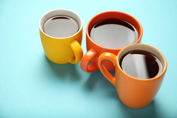 istock Black tea (coffee) in bright cups, office break, team building 1150433465