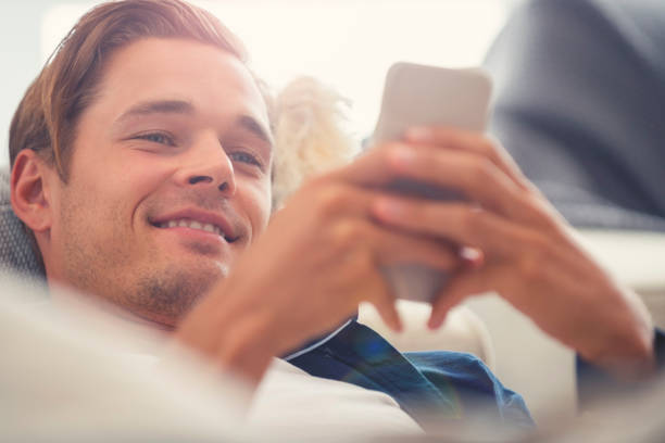 istock Man lying on the sofa with a mobile phone. 1150434176