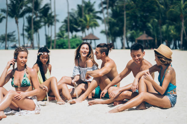 istock Group of friends chatting on the beach 1150434771